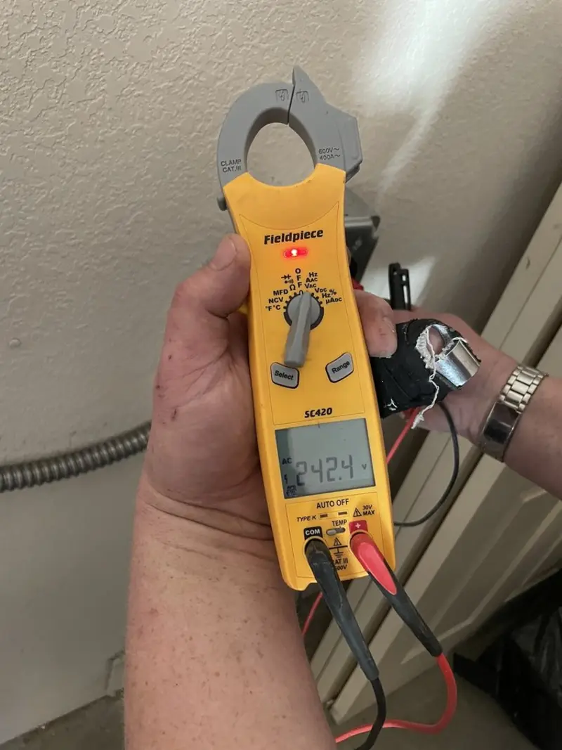 Voltage testing with clamp meter during Electrical Installation Services in Brown Deer
